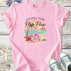 Pink t-shirt with 'Living the Flip Flop Life' graphic featuring flip flops and tropical scene.