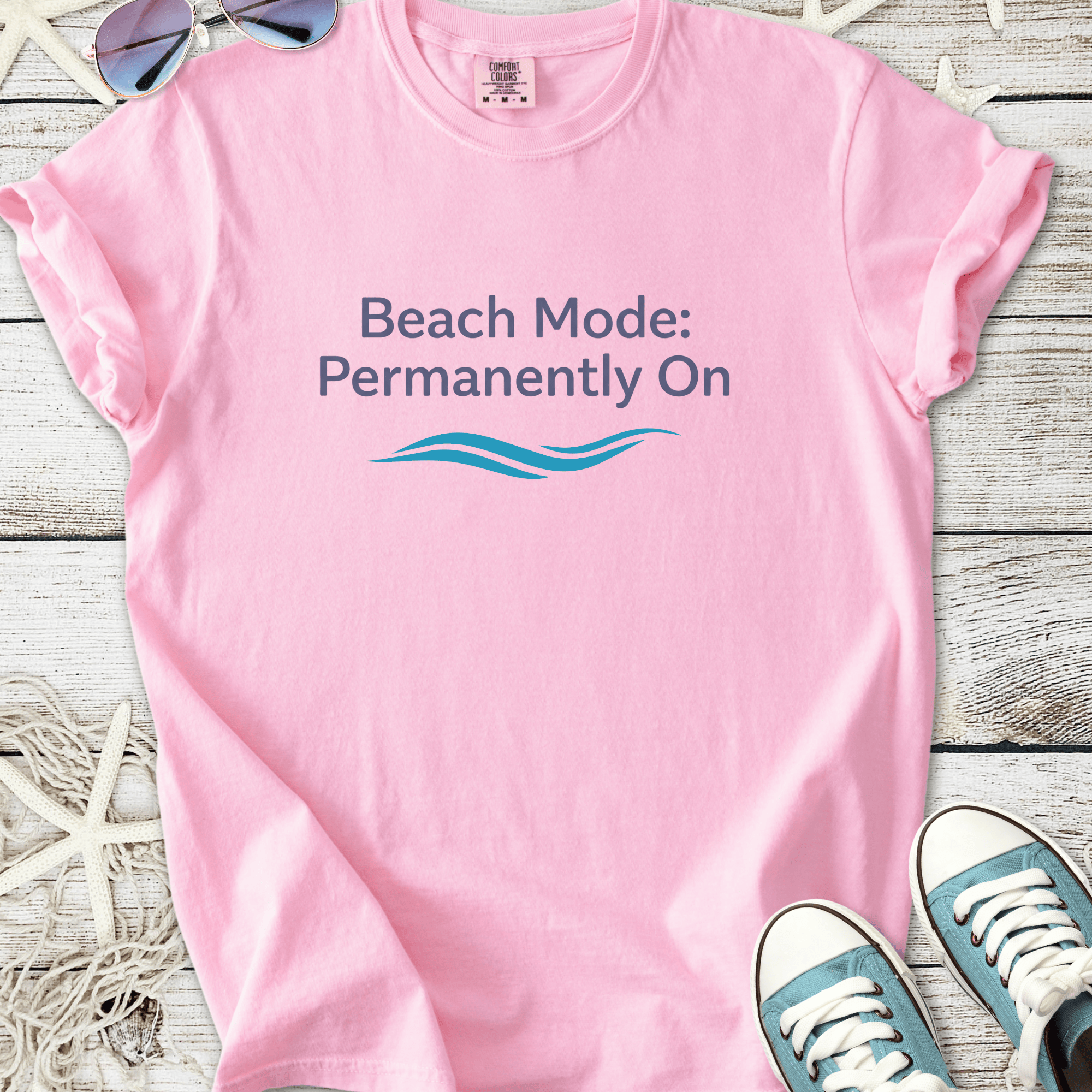 Pink t-shirt with 'Beach Mode: Permanently On' print, perfect for summer outings and beach days.