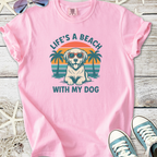 Pink graphic t-shirt featuring a dog in sunglasses and palm trees with the text 'Life's a Beach with My Dog'.