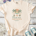Light peach graphic tee featuring palm trees and sunset design, perfect for casual summer wear.