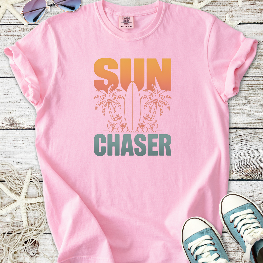Pink cotton t-shirt with 'SUN CHASER' graphic and surf design, perfect for summer casual wear.