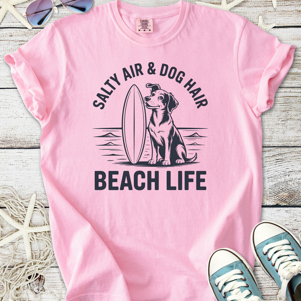 Light pink t-shirt with 'Salty Air & Dog Hair Beach Life' graphic and dog illustration, perfect for beach lovers.