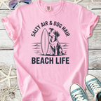 Light pink t-shirt with 'Salty Air & Dog Hair Beach Life' graphic and dog illustration, perfect for beach lovers.