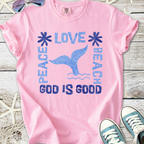 Pink graphic tee with 'Peace Love Beach' and whale tail design, perfect for summer casual style.