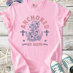Pink cotton t-shirt with 'Anchored by Hope' graphic featuring an anchor and floral design.