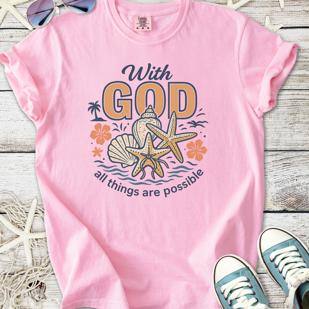 Pink faith based beach themed graphic t-shirt with seashells, starfish, flowers, and ‘With God all things are possible’ text
