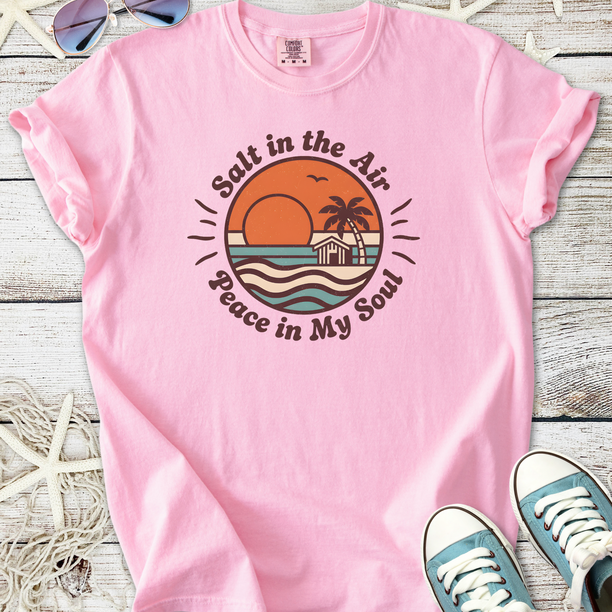 Light pink t-shirt with 'Salt in the Air, Peace in My Soul' graphic, perfect for beach lovers.