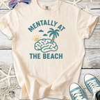 Light peach t-shirt with 'Mentally at the Beach' graphic, featuring a brain, palm tree, and sun.