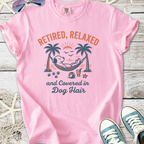 Light pink t-shirt featuring a relaxing dog graphic, saying 'Retired, Relaxed and Covered in Dog Hair'.