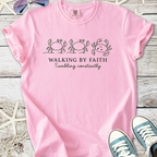 Pink graphic t-shirt featuring crabs and the phrase 'Walking by Faith' for a fun, casual style.