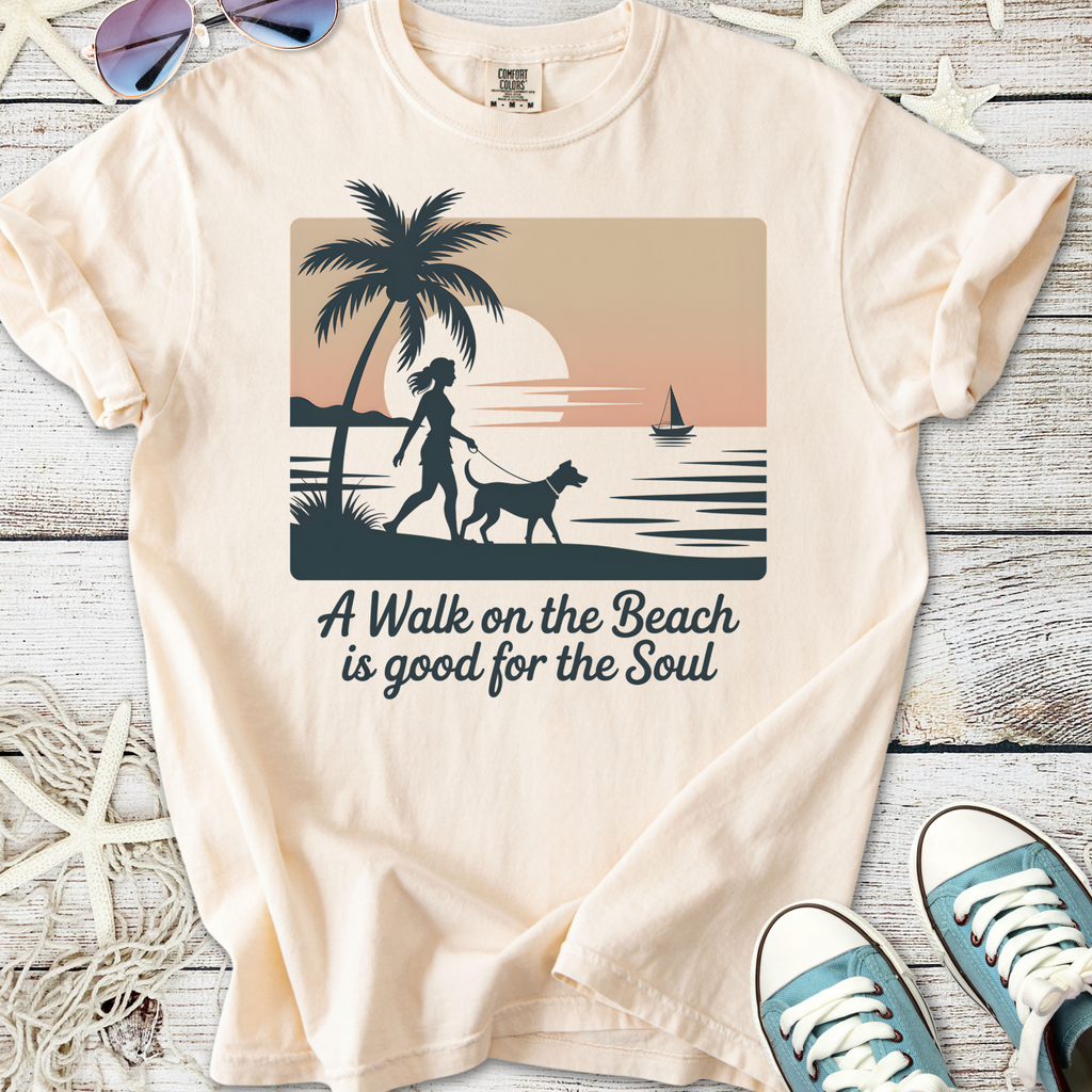 Cream graphic tee with beach scene, palm tree, woman walking dog, and text about soul benefits of beach walks.