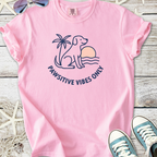 Pink cotton t-shirt featuring a cute dog and palm tree design with 'Pawsitive Vibes Only' slogan.