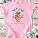 Pink t-shirt featuring a cartoon dog in vacation attire with 'Retired' slogan, perfect for beach lovers.