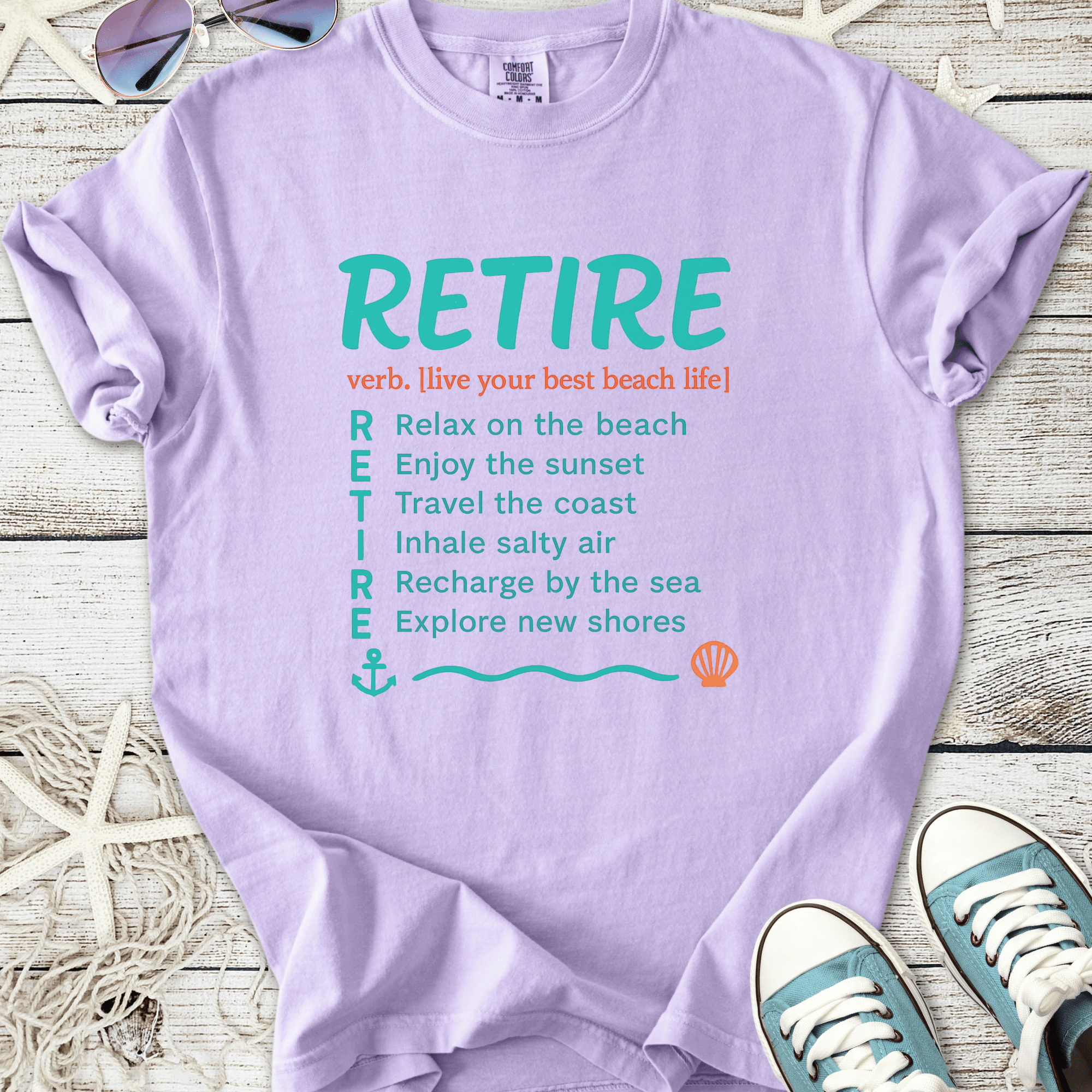 Lavender RETIRE graphic t-shirt, soft cotton, beach life theme, features relaxation and travel quotes.