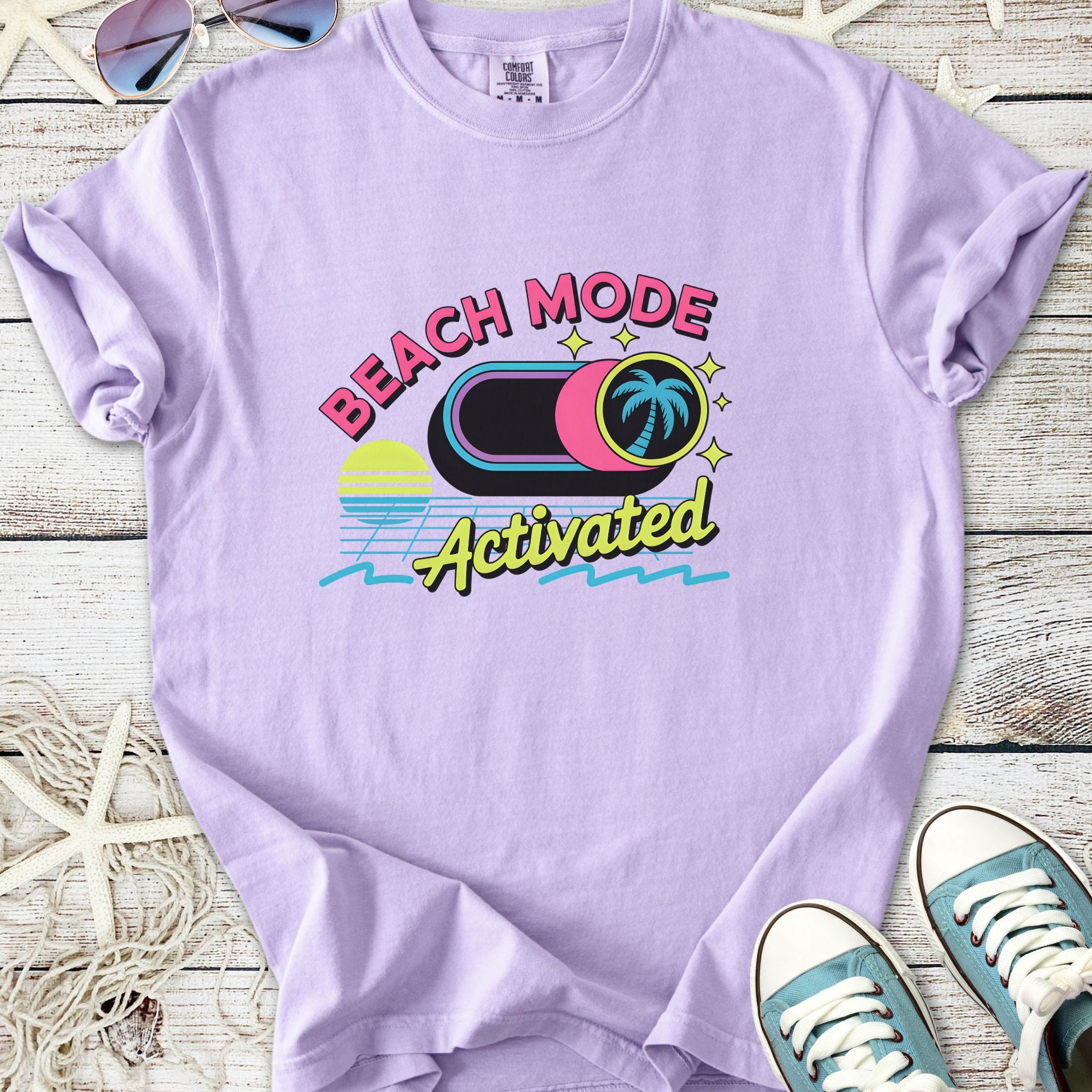 Lilac graphic t-shirt with 'Beach Mode Activated' print and palm tree design, perfect for summer outings.