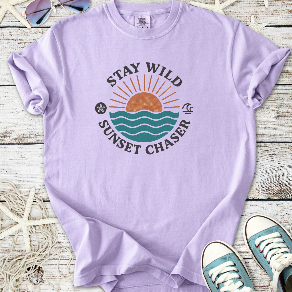 Lavender graphic t-shirt with 'Stay Wild Sunset Chaser' design, made from soft cotton, perfect for casual wear.