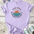 Lavender graphic t-shirt with 'Stay Wild Sunset Chaser' design, made from soft cotton, perfect for casual wear.