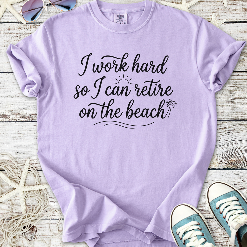 Lavender cotton t-shirt with 'I work hard so I can retire on the beach' print and casual sneakers.