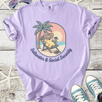 Light purple t-shirt with a playful graphic of a bird relaxing on a beach, perfect for summer vibes.