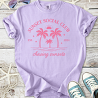 Light purple cotton t-shirt with palm tree graphic, 'Sunset Social Club' design, perfect for summer outings.