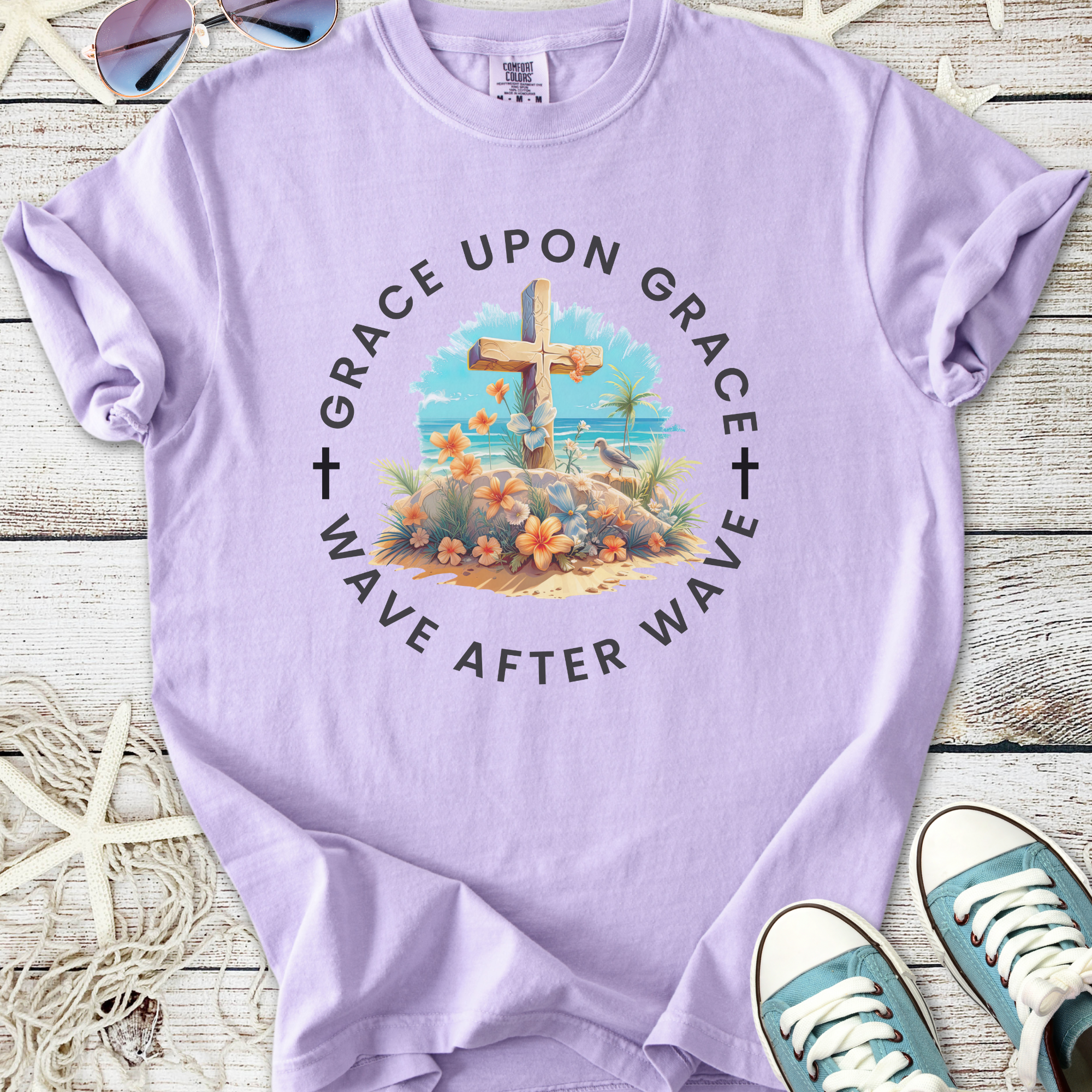 Lavender graphic tee with floral design and cross, featuring 'Grace Upon Grace' text, perfect for casual wear.