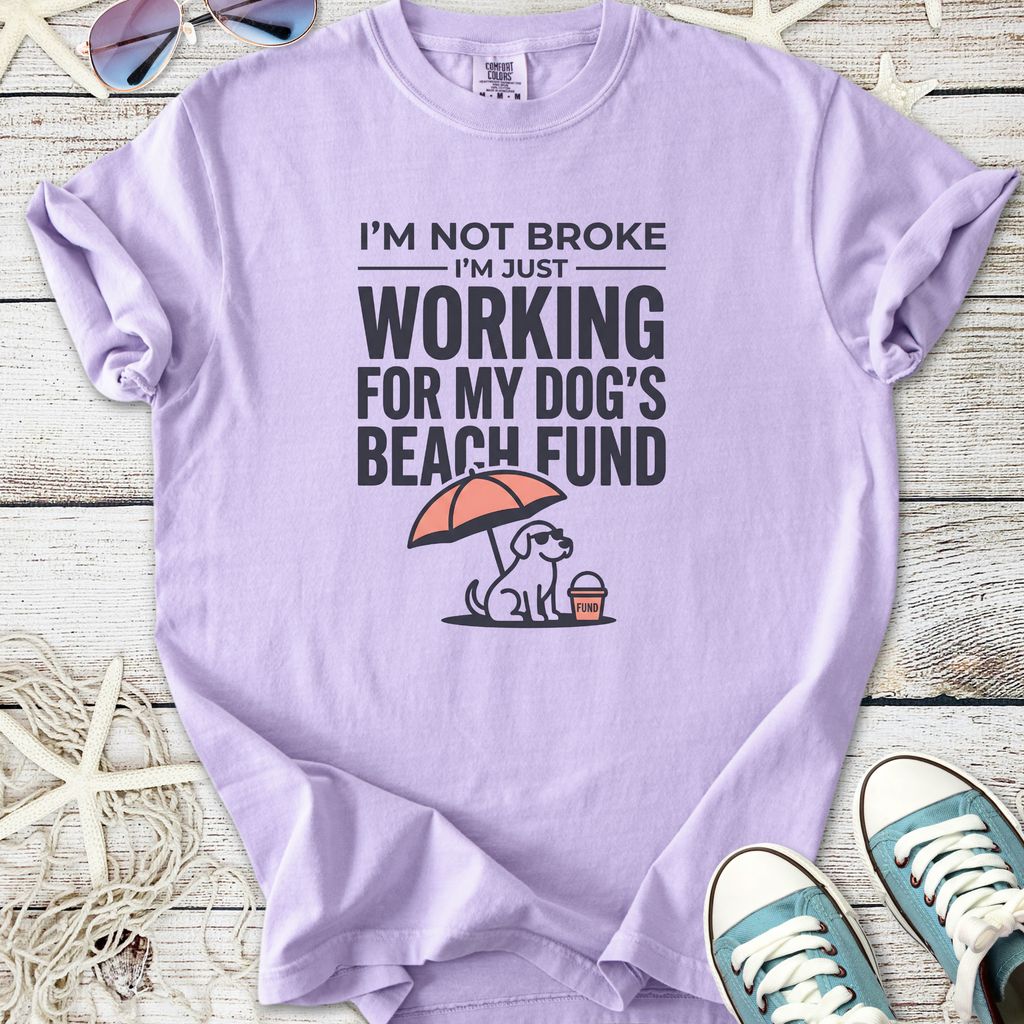 Light purple t-shirt with humorous 'dog beach fund' graphic, soft cotton material, casual style.
