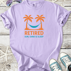 Lavender t-shirt with 'Retired Sun, Sand & Sleep' graphic, featuring palm trees and a hammock.