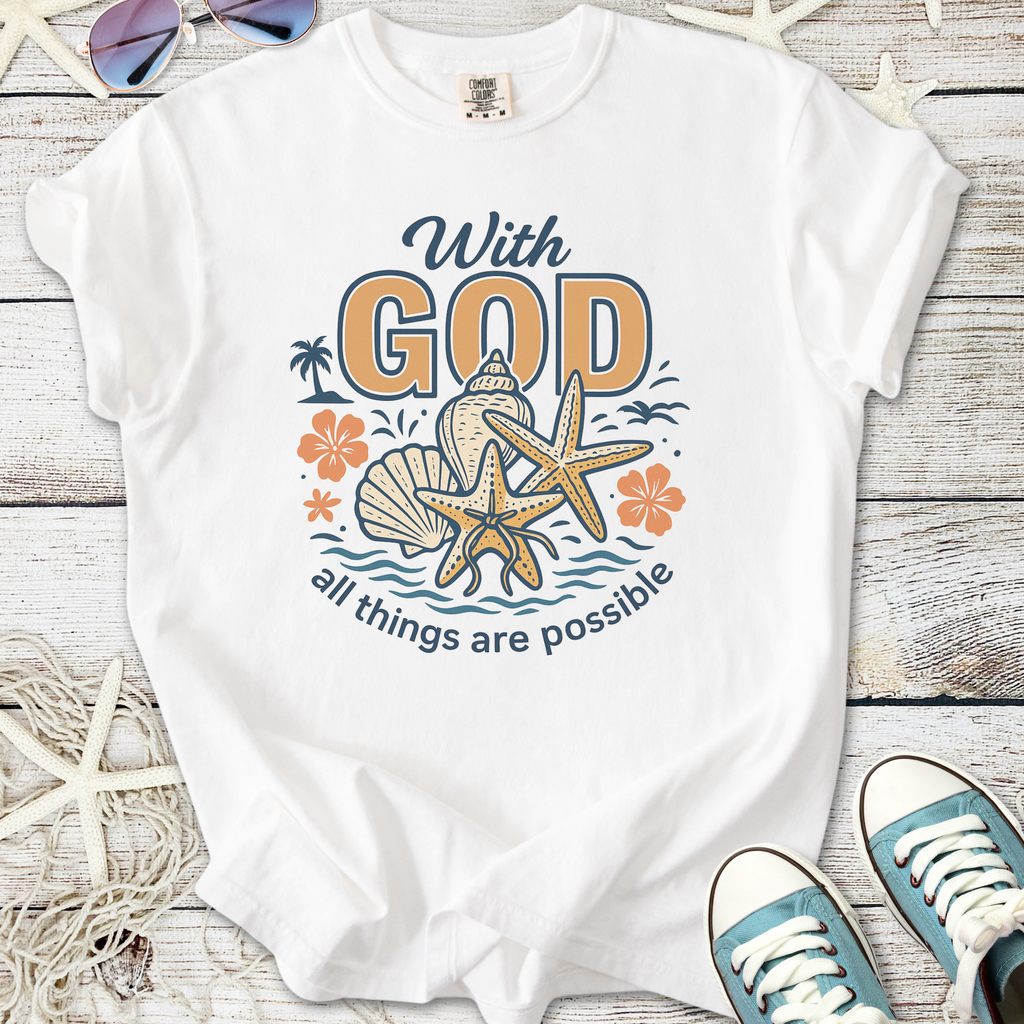 White t-shirt with beach-themed graphic, featuring text 'With God all things are possible' and marine elements.