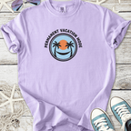 Light purple t-shirt with 'Permanent Vacation Mode' graphic, featuring palm trees and a sunset design.