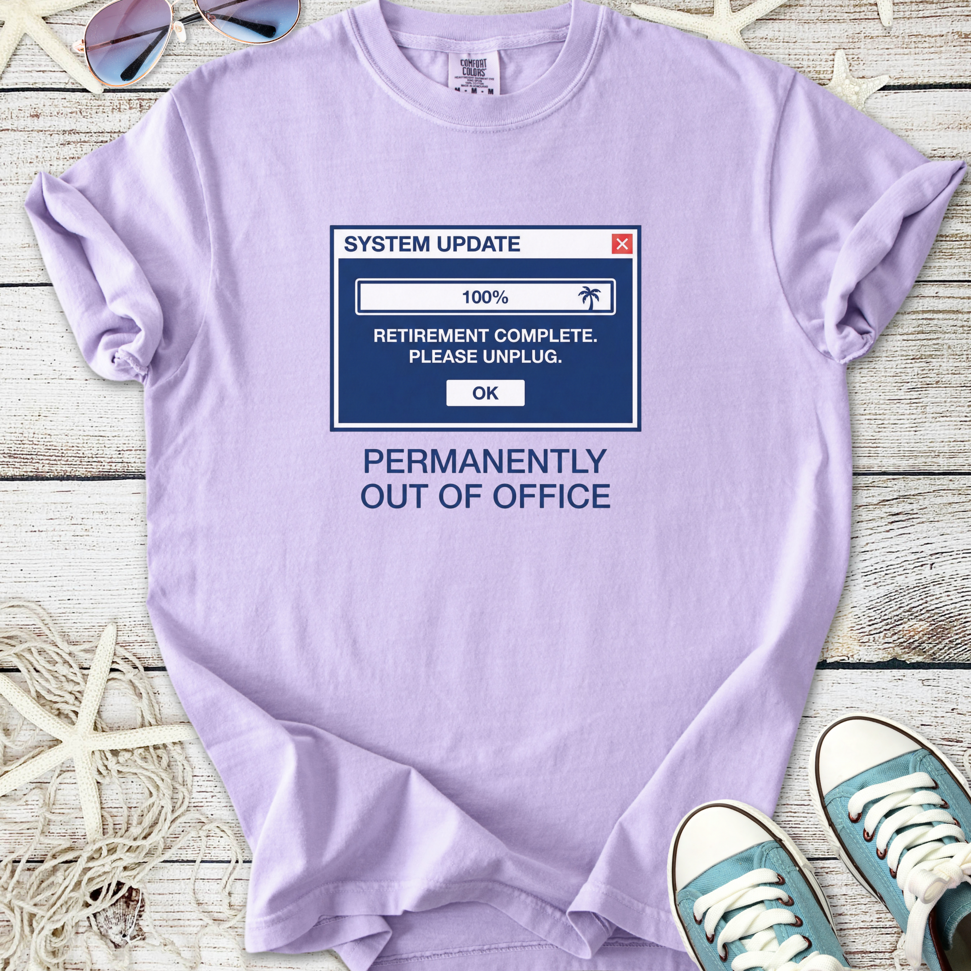 Light purple t-shirt with humorous 'Permanently Out of Office' graphic, cotton material, perfect for casual wear.
