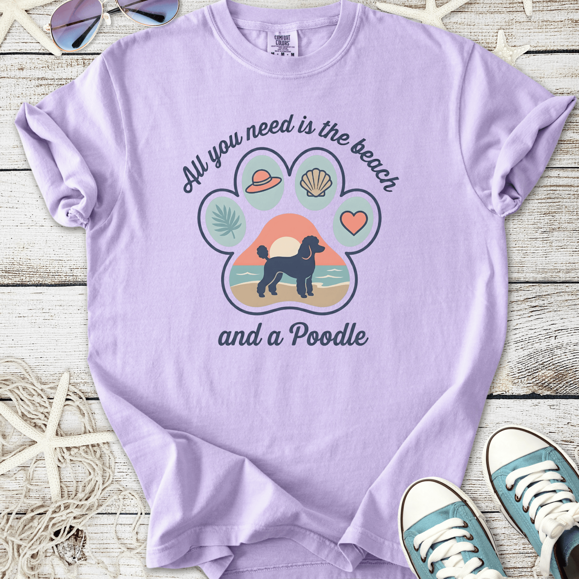 Light purple t-shirt with a beach-themed poodle graphic, perfect for dog lovers.