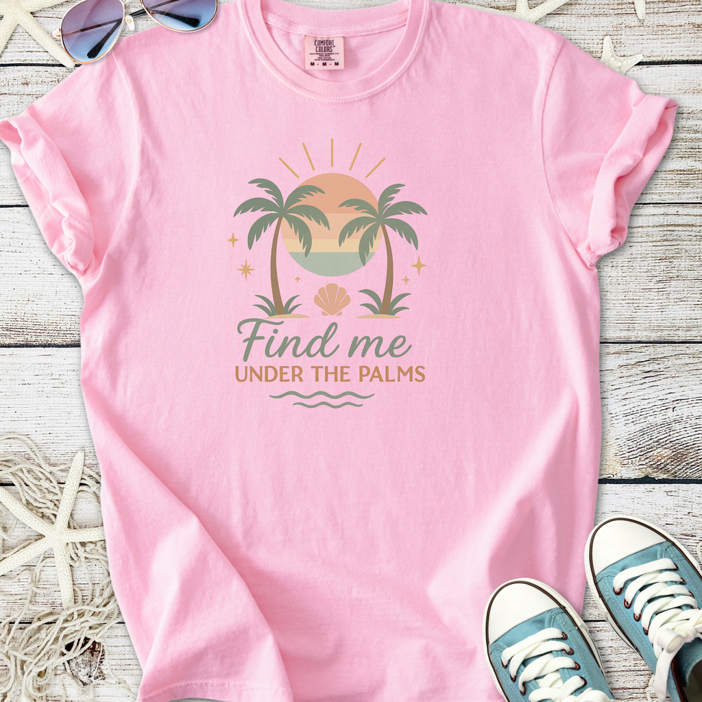 Pink graphic tee featuring palm trees and sunset design, ideal for beach lovers.