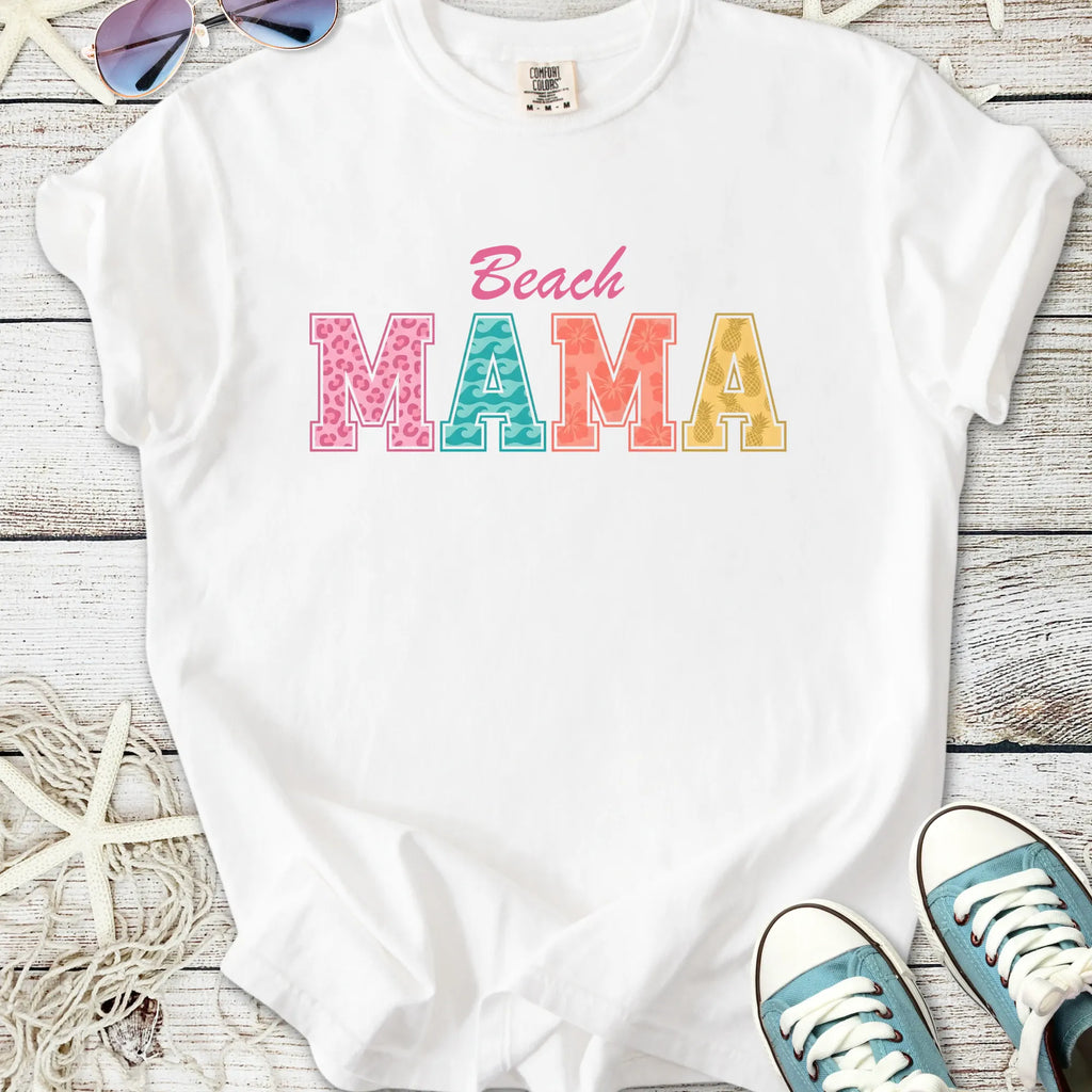 White cotton t-shirt with colorful 'Beach MAMA' graphic, perfect for summer outings.