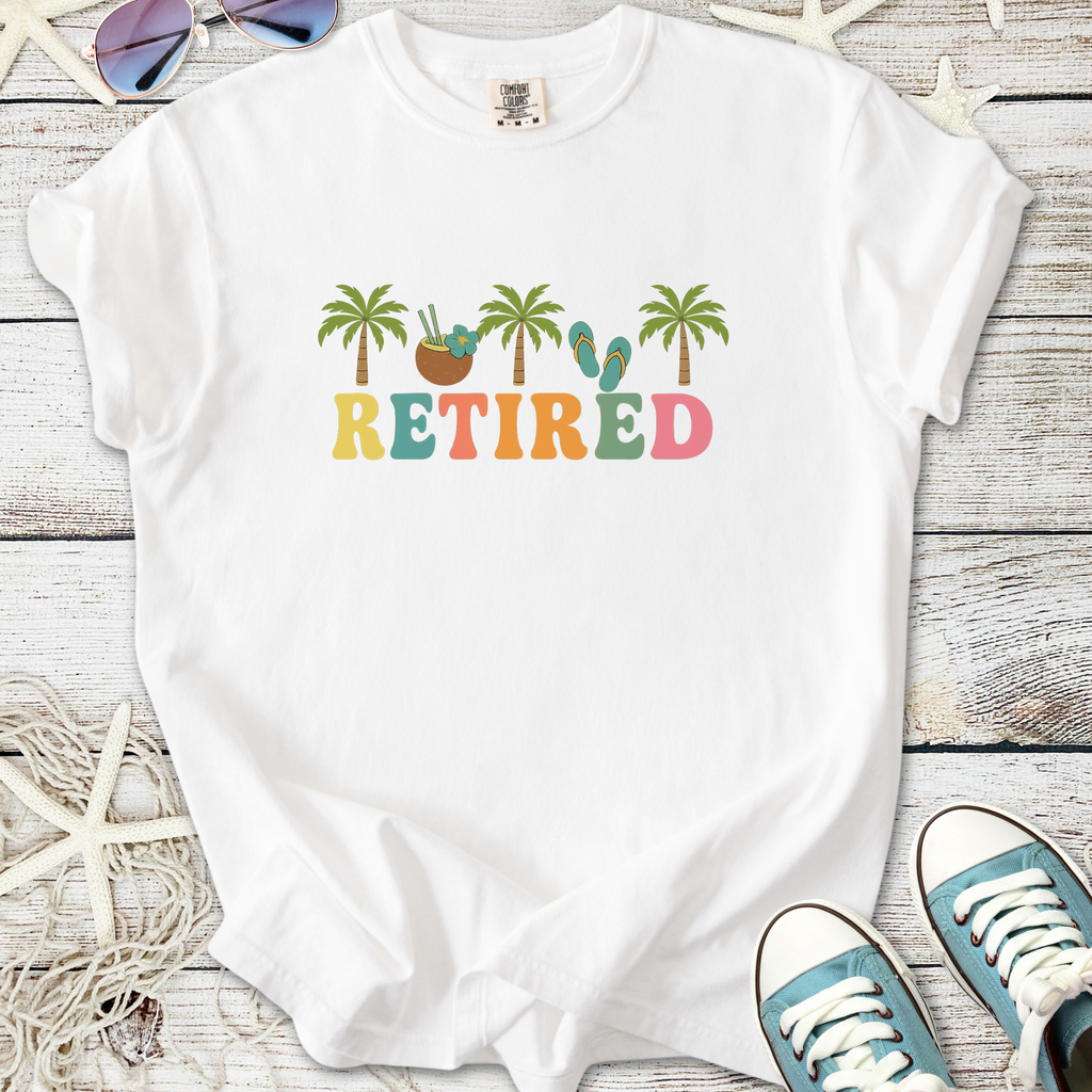 White retired graphic tee with palm trees, coconut, and flip-flops design. Perfect for leisure wear.