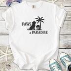 White cotton t-shirt featuring 'Paws & Paradise' design with a dog silhouette and palm tree.