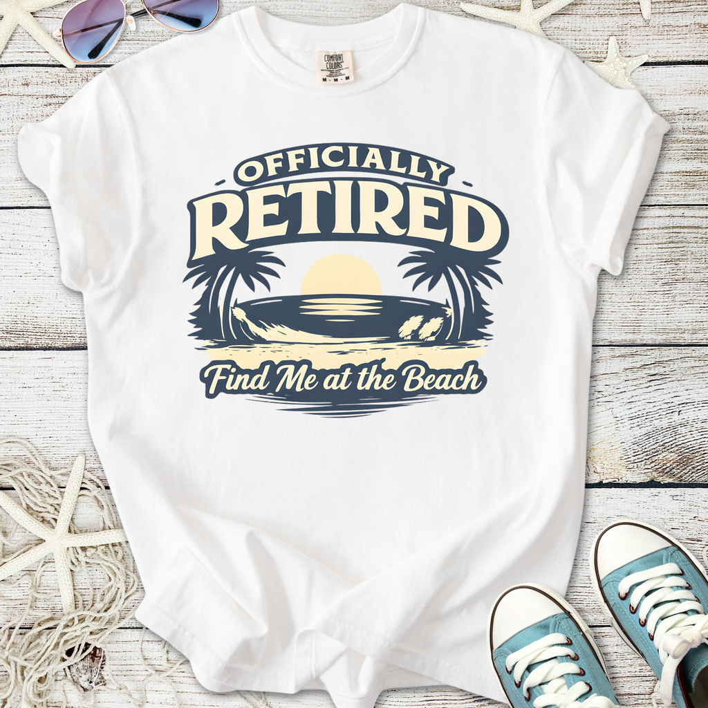 White t-shirt with 'Officially Retired' beach graphic and palm trees, perfect for beach lovers.