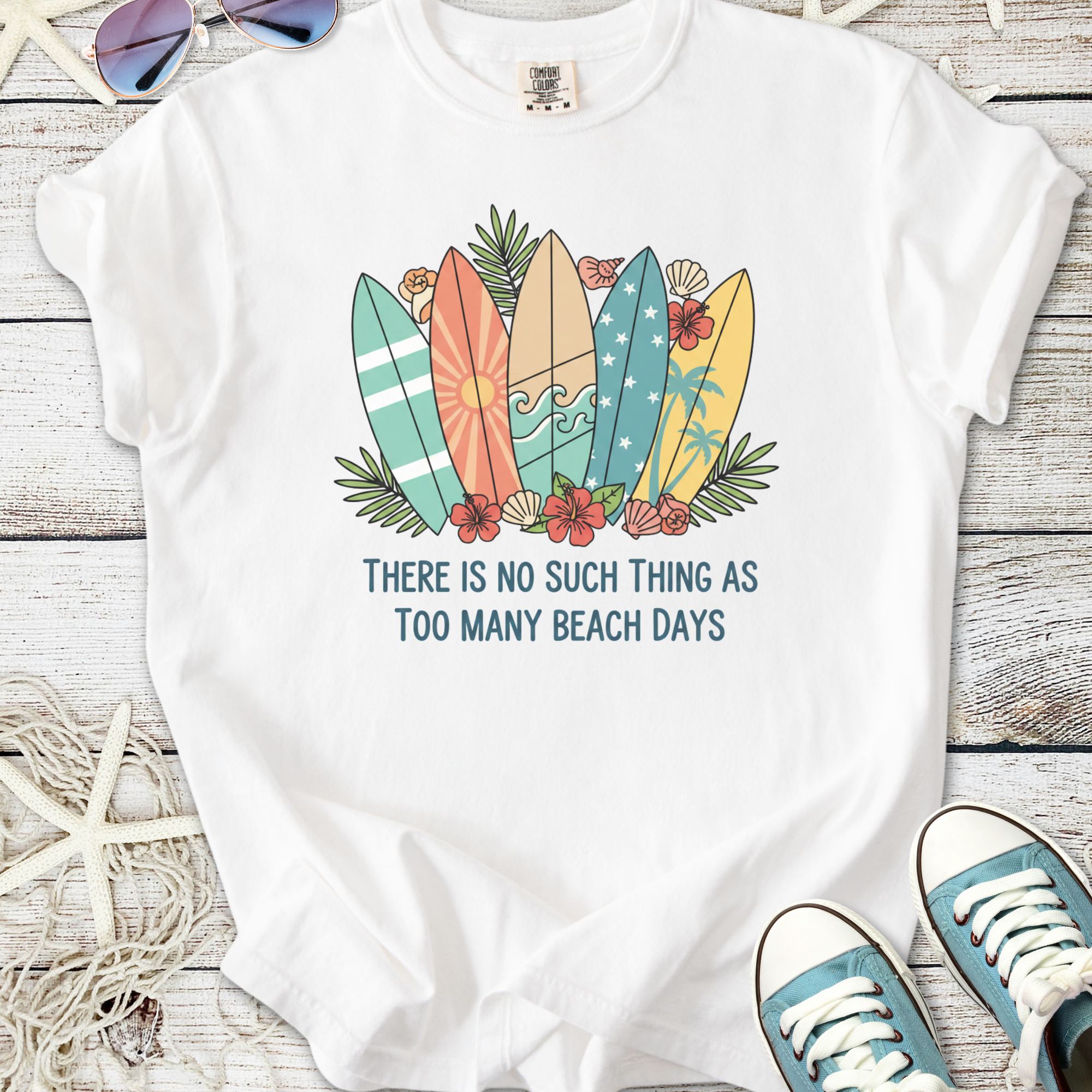 White graphic tee with colorful surfboards and text about beach days, perfect for summer wear.