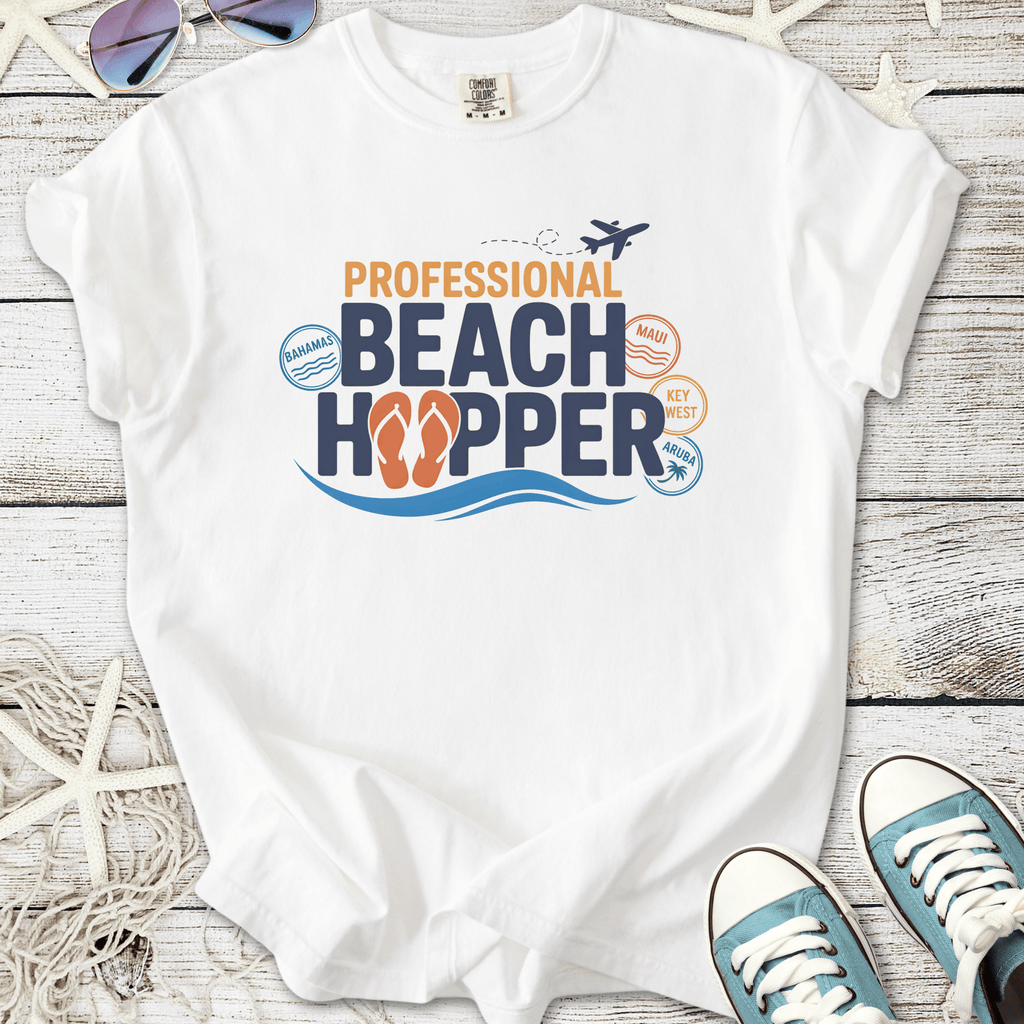White t-shirt featuring 'Professional Beach Hopper' graphic with flip flops, ideal for beach lovers.