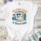 White t-shirt featuring a playful dog graphic and 'My Dog Said We Needed A Beach Day' text.