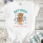 White retirement beach themed t-shirt with dog in beach clothes and ‘Retired — Bye Office, Hello Beach’ text