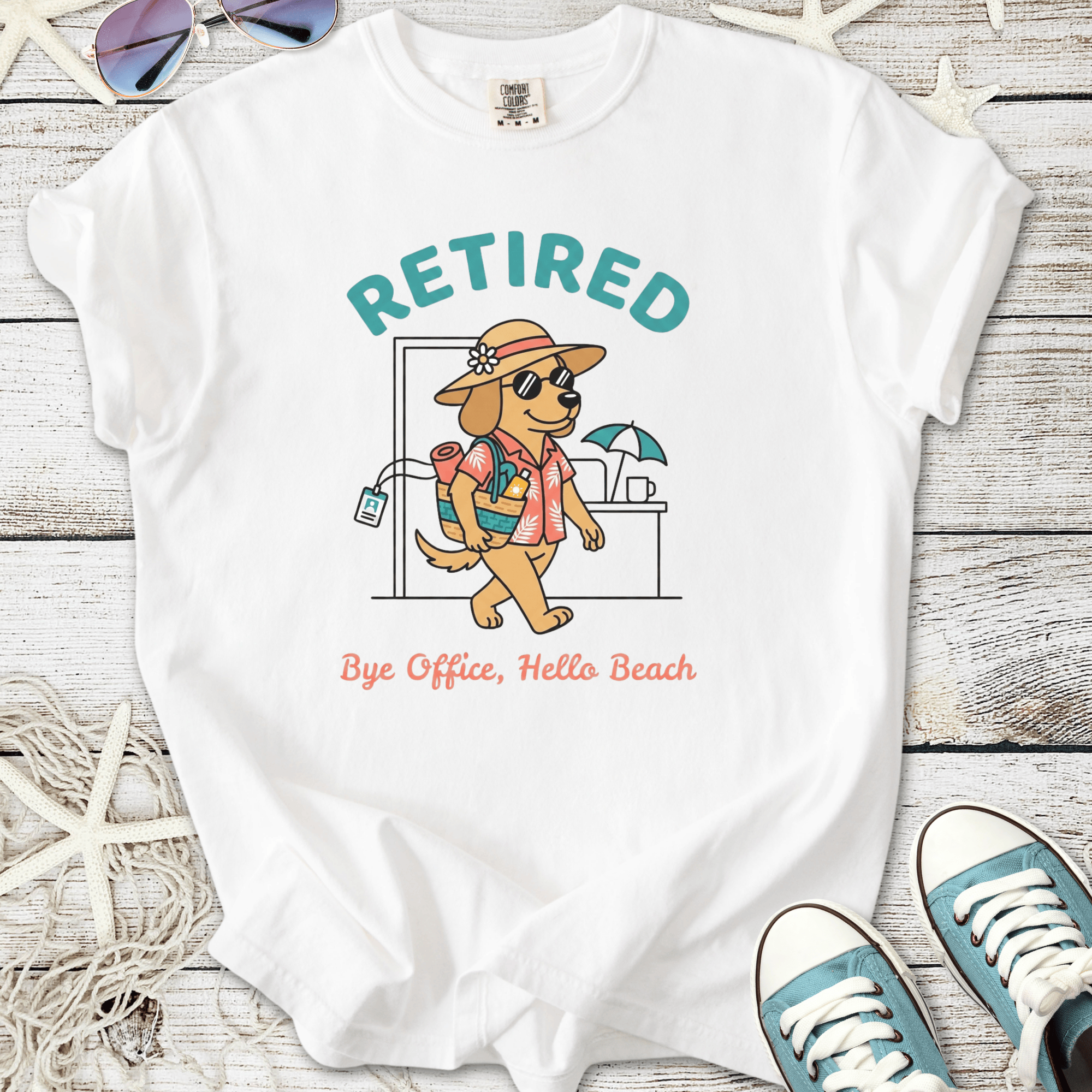 White retirement beach themed t-shirt with dog in beach clothes and ‘Retired — Bye Office, Hello Beach’ text