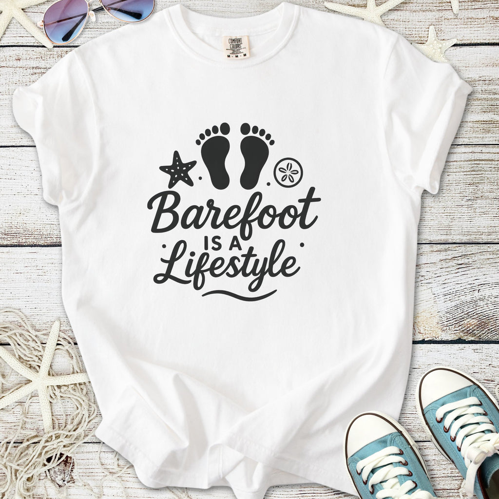White cotton t-shirt with 'Barefoot is a Lifestyle' design, featuring footprints and beach elements.