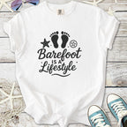 White cotton t-shirt with 'Barefoot is a Lifestyle' design, featuring footprints and beach elements.