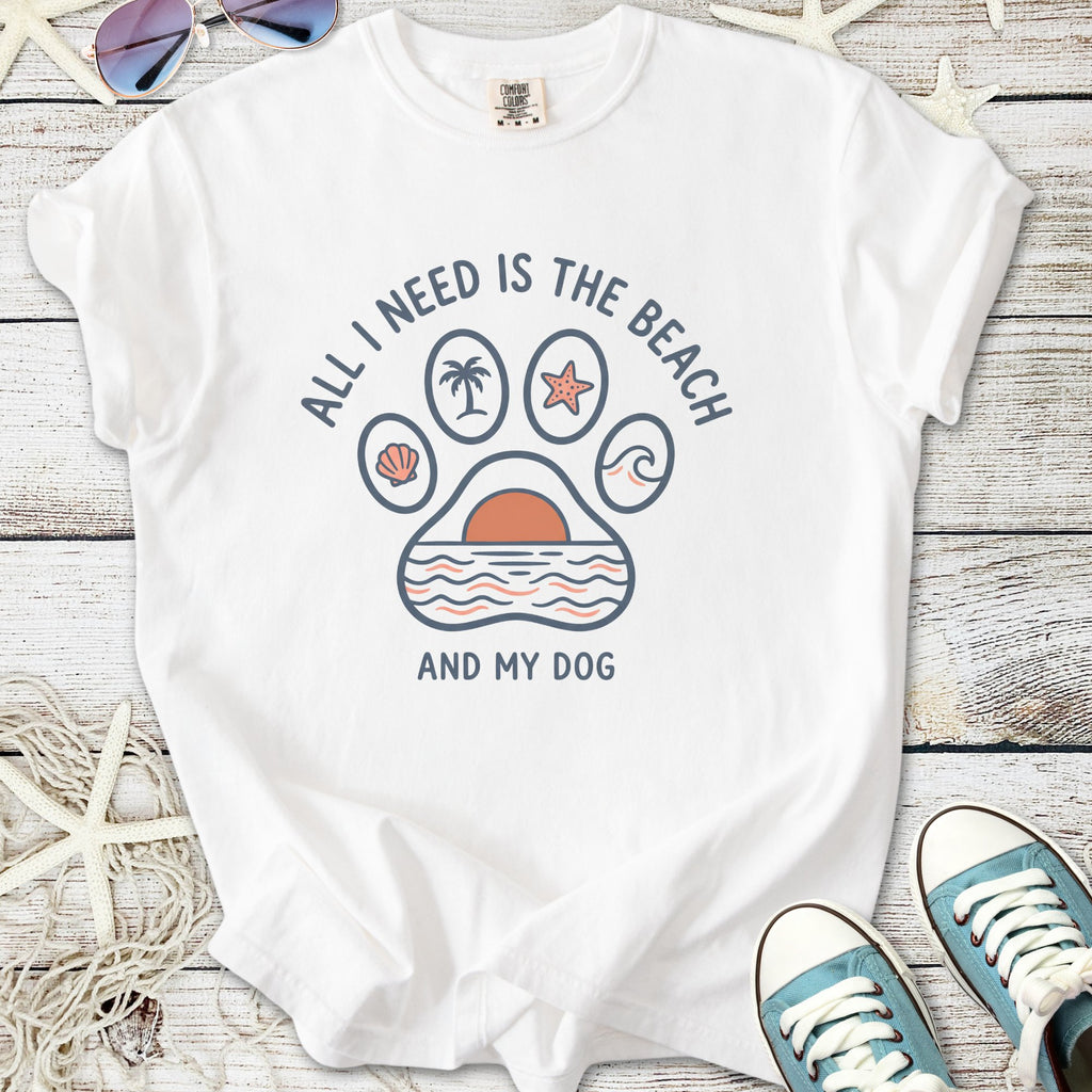 White graphic tee with a beach-themed design: palm trees, sun, and dog paw print.