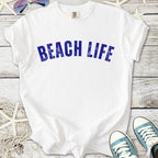 White t-shirt with blue 'BEACH LIFE' graphic, perfect for summer wear and beach outings.