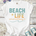 White t-shirt with 'Beach Life' print, perfect for retirees, made from soft cotton.