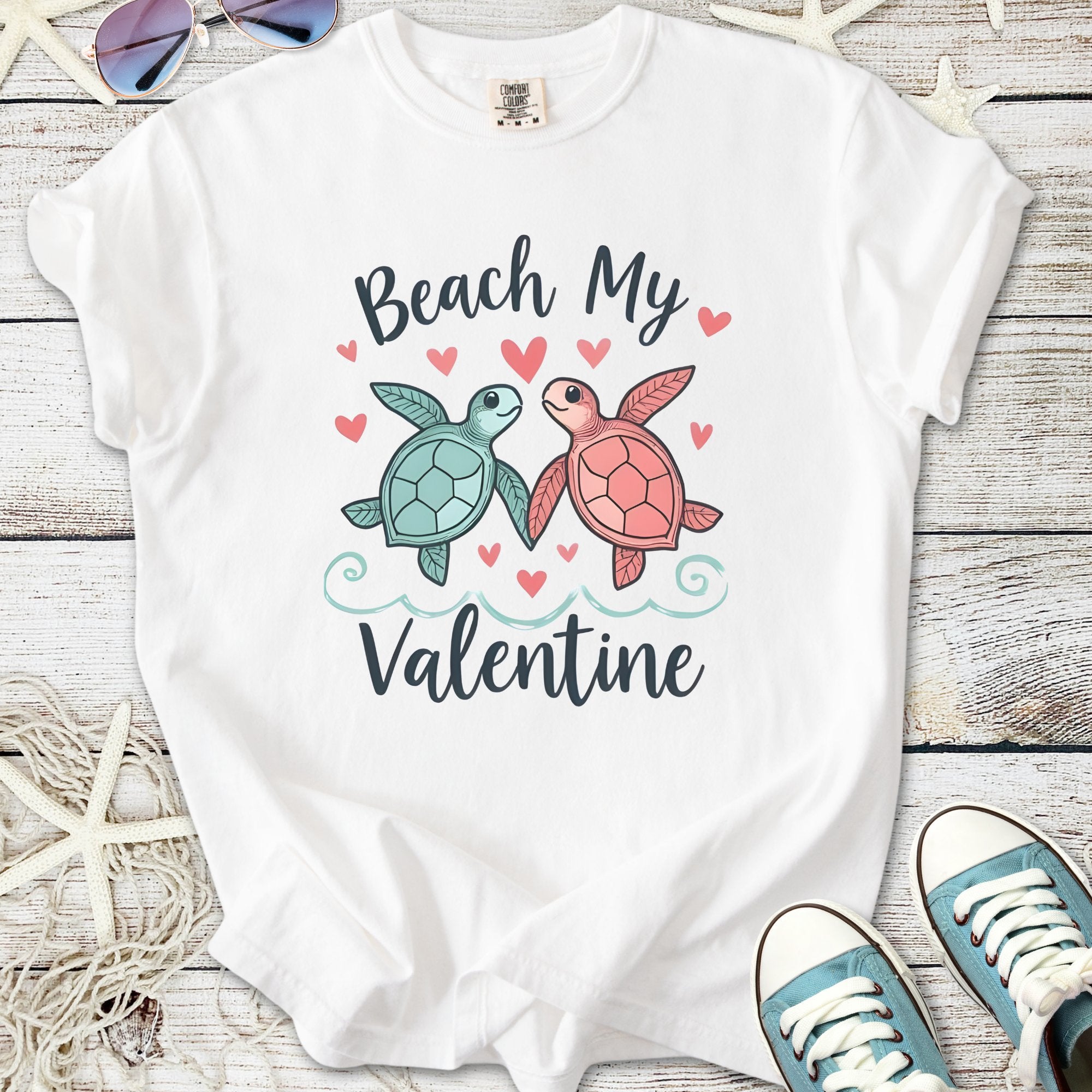White t-shirt with 'Beach My Valentine' graphic featuring cute turtles and hearts.
