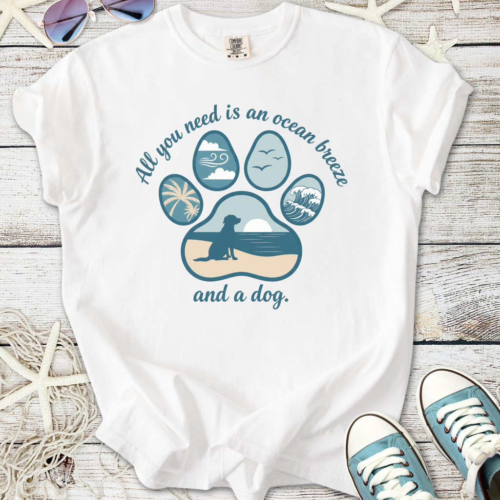 White t-shirt with ocean breeze dog graphic design and paw print, perfect for beach lovers.