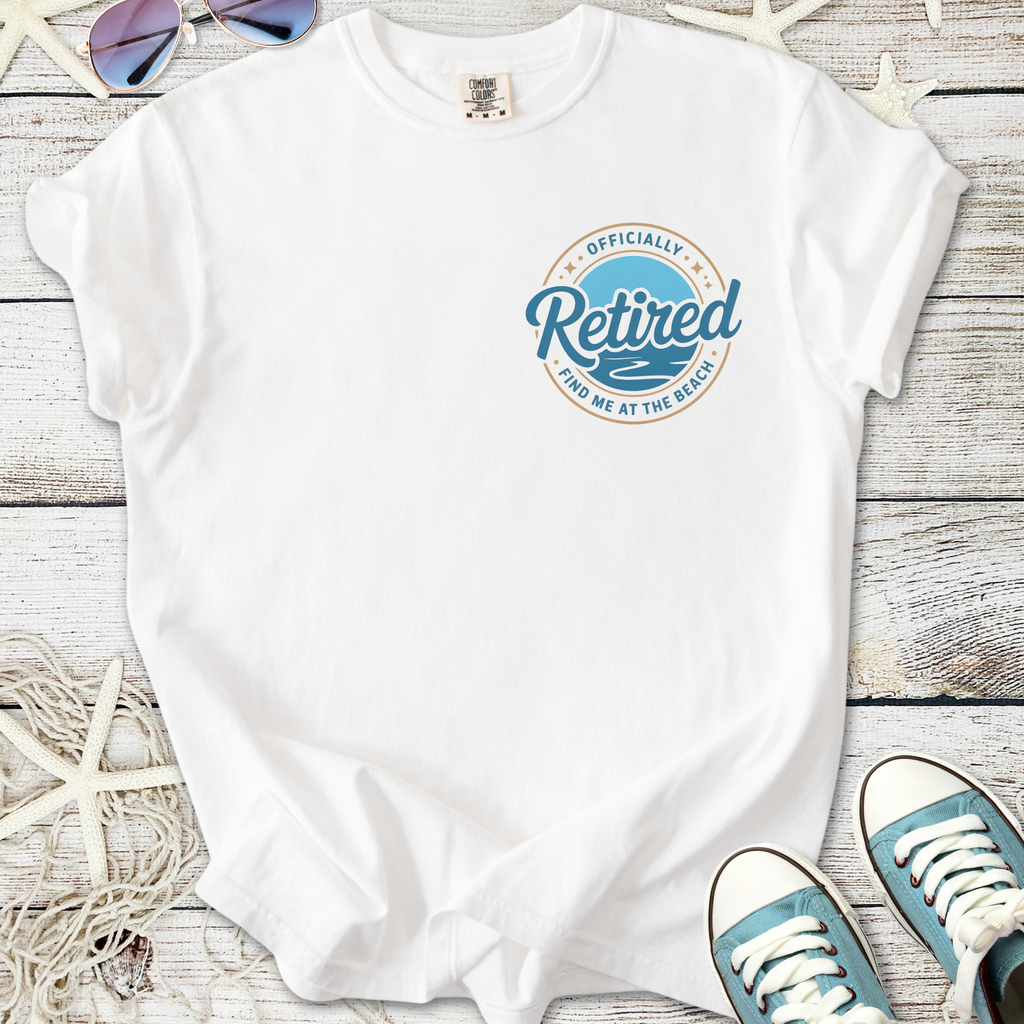 White t-shirt with 'Officially Retired' graphic, perfect for beach lovers and casual wear.