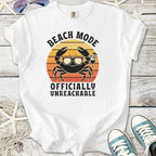 White t-shirt with 'Beach Mode Officially Unreachable' crab graphic, perfect for summer vibes.